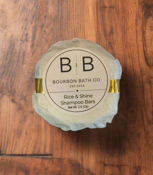 Shampoo bar with Bourbon Bath Co label on a reflective surface